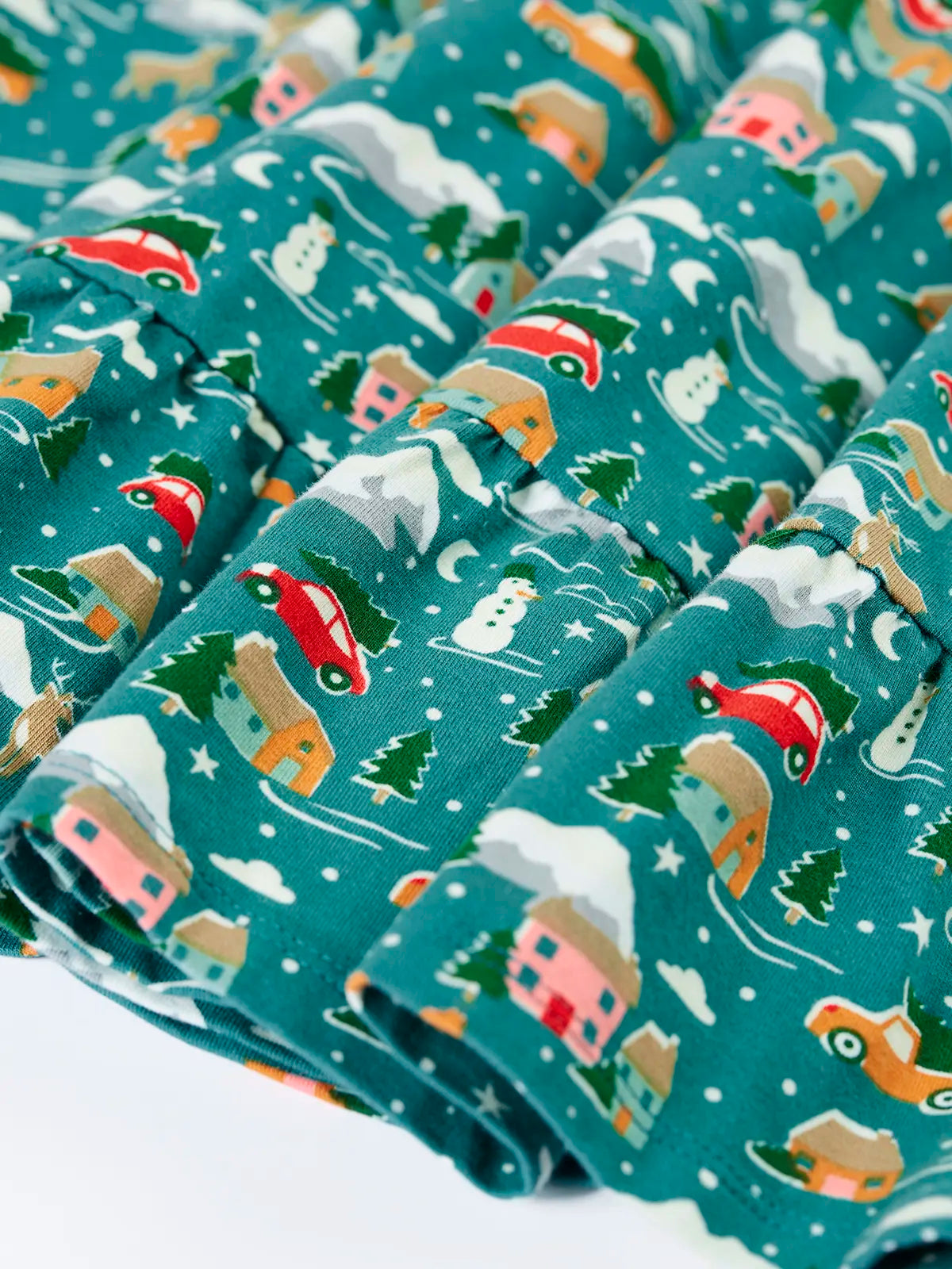 Close up of the all over Winter drives print on the Frugi organic cotton Annika long sleeve skater dress.