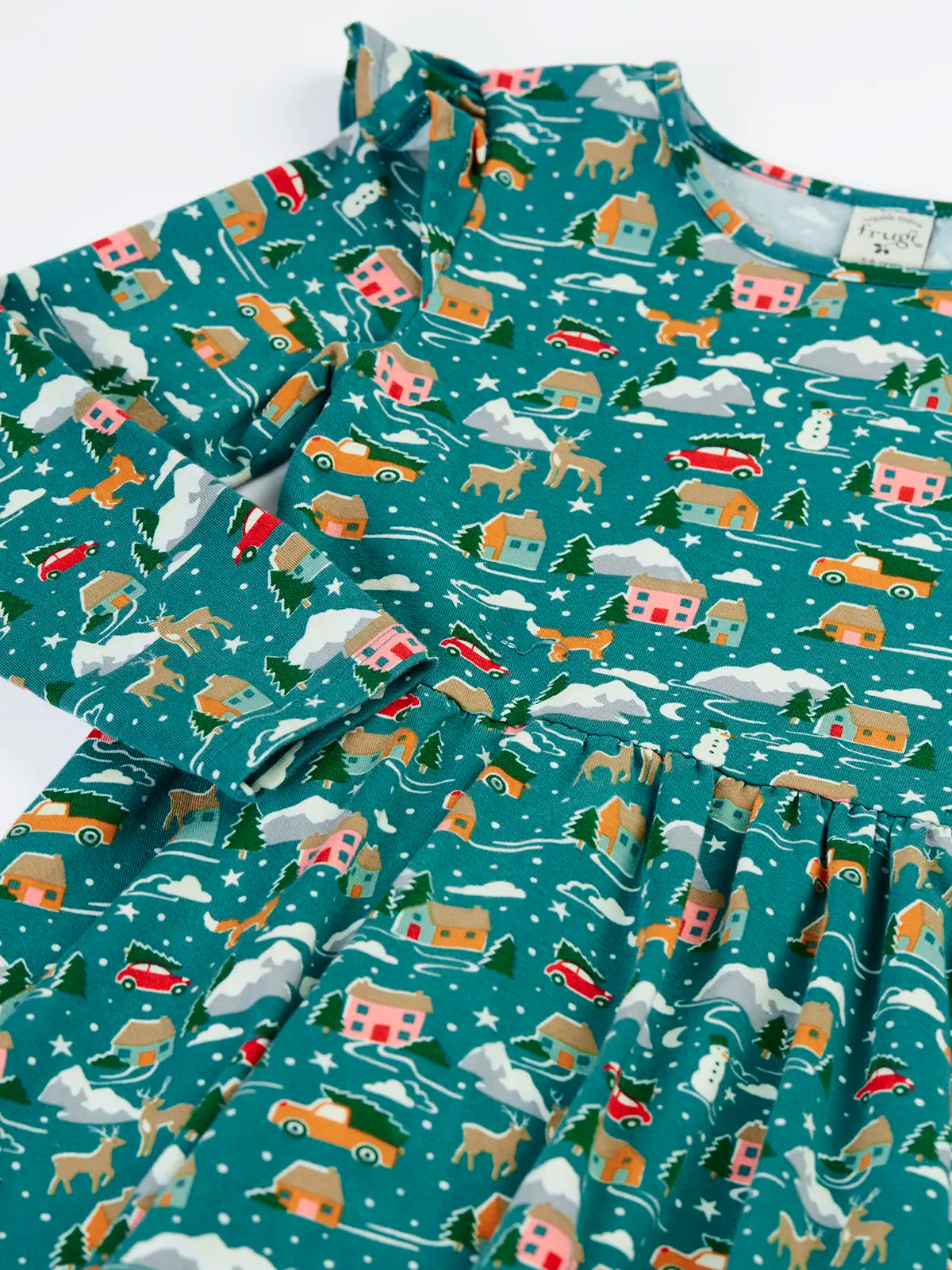Close up of the Frugi winter drives organic cotton Annika long sleeve skater dress showing the frilled shoulders.