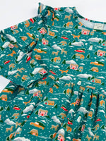 Close up of the Frugi winter drives organic cotton Annika long sleeve skater dress showing the frilled shoulders.