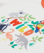 A close up of Frugi Xavier Circus T-Shirt in Soft White, featuring the word 'WILD' embroidered surrounded by exotic animals.