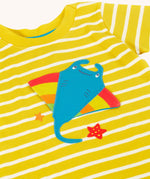 A close up of the interactive ray applique on the front of the Frugi interactive ray applique yellow breton stripe organic cotton short sleeved T-Shirt.