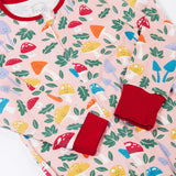 A close up of the red coloured sleeve cuffs on the Frugi fun-guys design Zelah zip up all in one. The cuffs can be  folded down for extended wear.