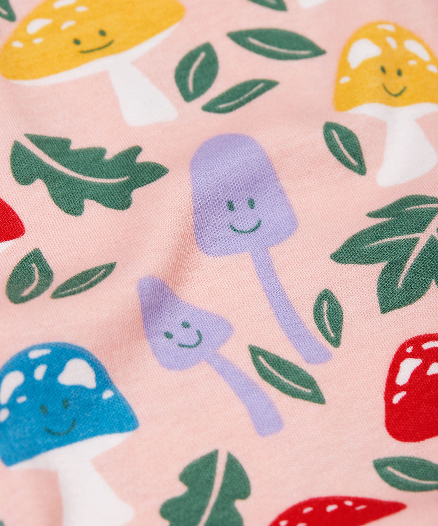 A close up of the Fun-Guys print on the Frugi Zelah zip up all in one.
