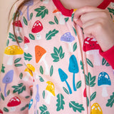 A closeup of the fun guys toadstool print on the Frugi organic cotton Zelah Zip Up Onesie.