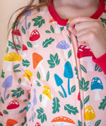 A closeup of the fun guys toadstool print on the Frugi organic cotton Zelah Zip Up Onesie.