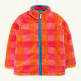 A frugi fuzzy zip-up fleece jacket with a vibrant pink and orange plaid pattern, a bright turquoise zipper, and a matching turquoise inner collar.