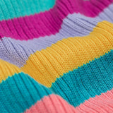A close up of the material of the Frugi Zoe knitted jumper wild rainbow stripe top. This child's top is made with organic cotton.