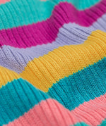 A close up of the material of the Frugi Zoe knitted jumper wild rainbow stripe top. This child's top is made with organic cotton.