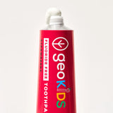 Georganics fluoride free strawberry hydroxyapatite toothpaste showing contents coming out of the nozzle