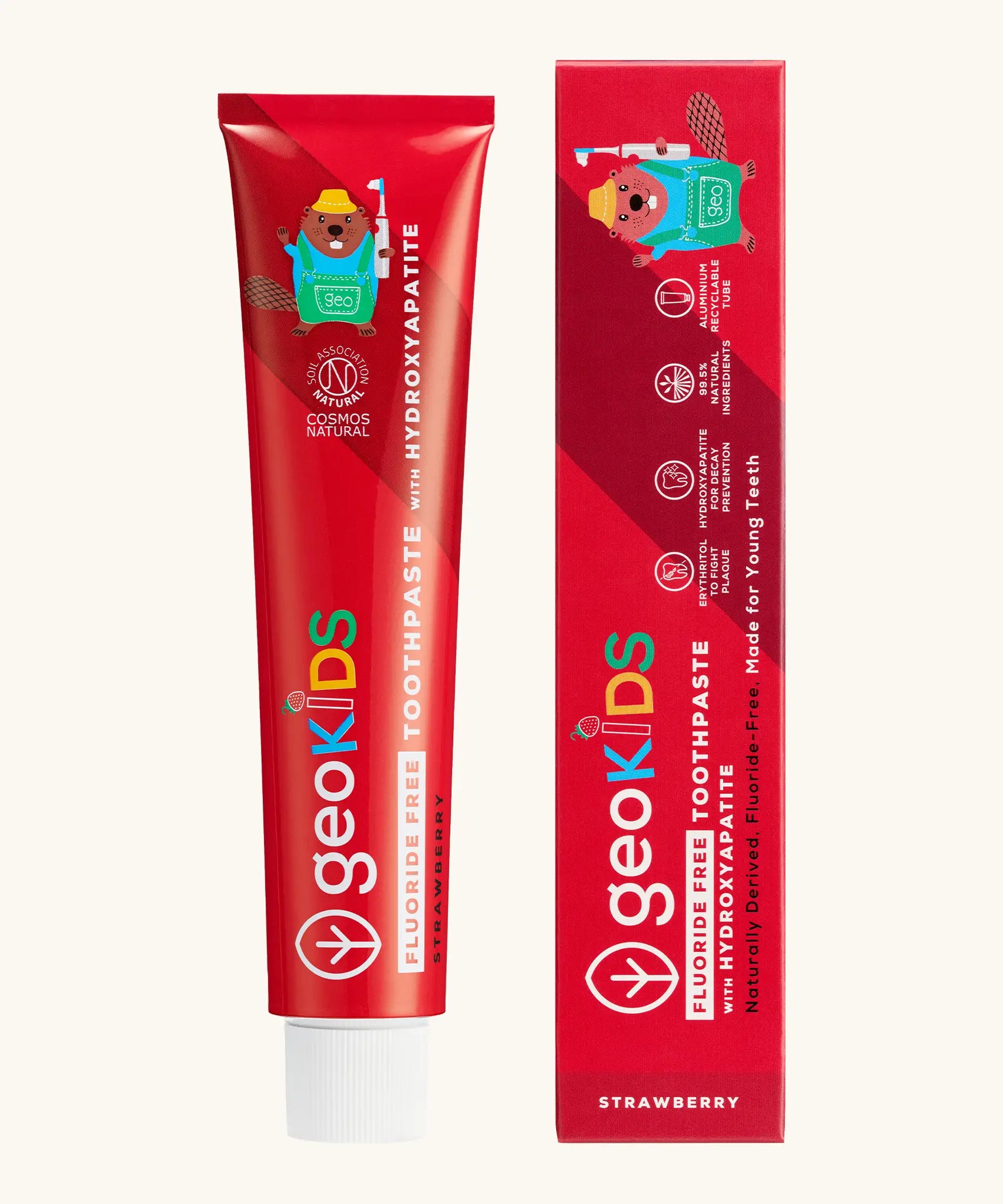 Front of the Georganics strawberry hydroxyapatite fluoride free toothpaste tube next to matching branded packaging 