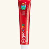 Red tube of Georganics strawberry fluoride free hydroxyapatite toothpaste. Features a playful beaver design and white branding text