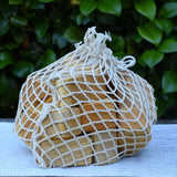 Glückskäfer 17 small natural blocks in their string storage net bag.