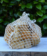 Glückskäfer 17 small natural blocks in their string storage net bag.