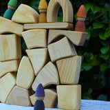 Glückskäfer 17 small natural blocks stacked up with Grapat Tomten Nins placed on them.