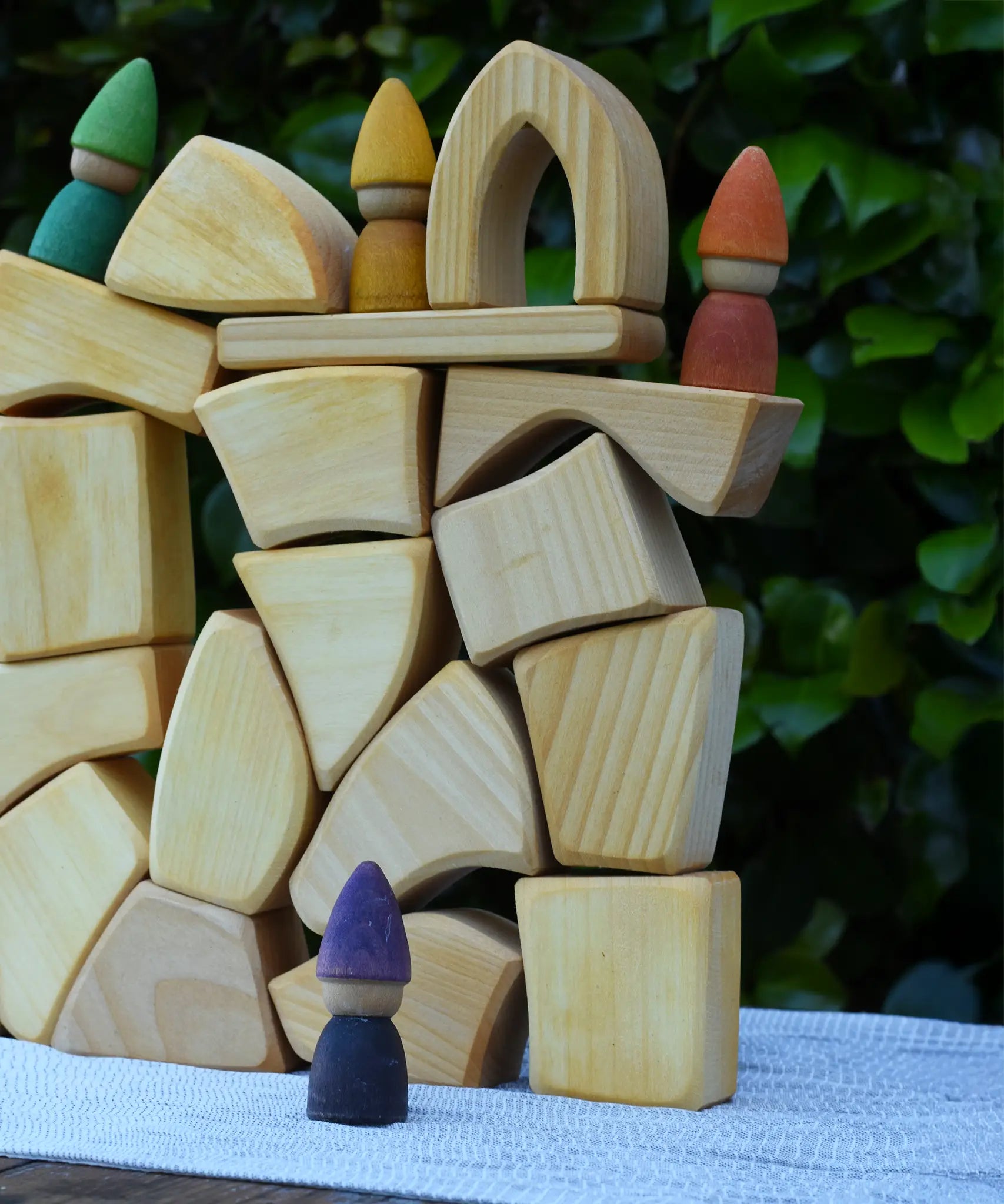 Glückskäfer 17 small natural blocks stacked up with Grapat Tomten Nins placed on them.