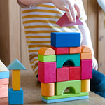 A child building with the blocks from the Glückskäfer 27 Piece Building Blocks Set.