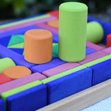 Glückskäfer 53 piece big provence wooden blocks set in a storage display tray with two cylinder blocks taken out and placed on top.