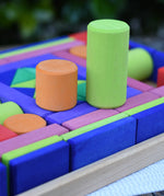 Glückskäfer 53 piece big provence wooden blocks set in a storage display tray with two cylinder blocks taken out and placed on top.