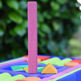 Glückskäfer 53 piece big provence wooden blocks set in a storage display tray with the largest and smallest block taken out and placed next to each other.