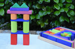 Glückskäfer 53 piece big provence wooden blocks set in a storage display tray with a tower created using some of the blocks built next to it.