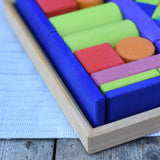 Glückskäfer 53 piece big provence wooden blocks set in a storage display tray, close up of the corner of the tray.