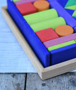 Glückskäfer 53 piece big provence wooden blocks set in a storage display tray, close up of the corner of the tray.