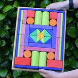 Glückskäfer 53 piece big provence wooden blocks set in a storage display tray in a child's hands.