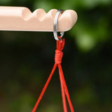 Close up of the ring hanger on the scales on the Glückskäfer balance with weights children's weighing scales toy.  