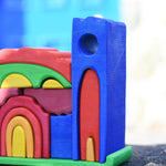 A close up of one of the tower pieces on the Gluckskafer blue castle wooden toy.