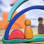 Pieces from the Glückskäfer Sunrise set used to create little houses for wooden peg dolls.