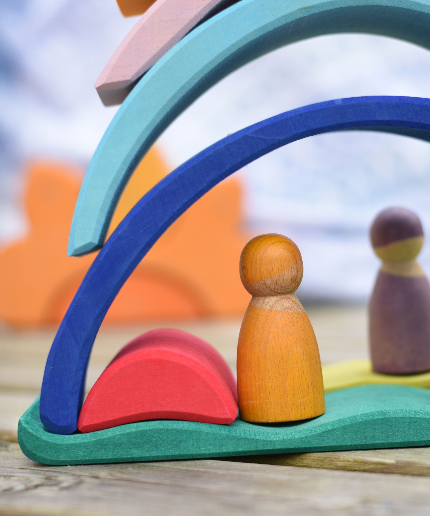 Pieces from the Glückskäfer Sunrise set used to create little houses for wooden peg dolls.