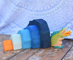 A Holztiger green dragon placed besides the Glückskäfer Blue Grotto.