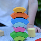 Curved pieces from the Glückskäfer circles quadrat construction kit stacked up on top of each other.