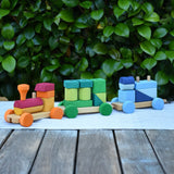Glückskäfer colourful shape train wooden toy placed on a table outdoors. 