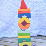 The Glückskäfer Crooked Tower placed on a wooden surface. 