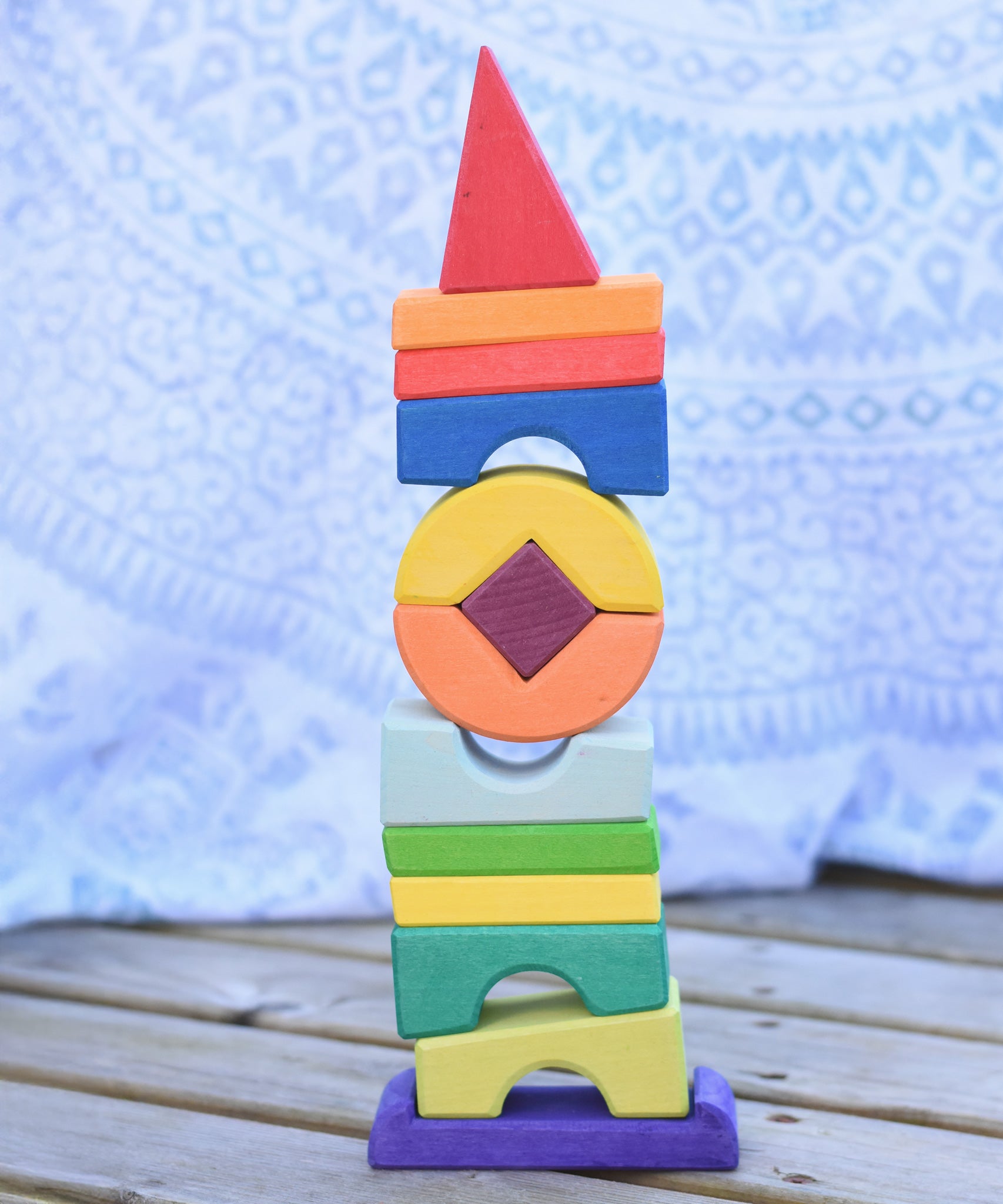 The Glückskäfer Crooked Tower placed on a wooden surface. 