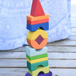 The Glückskäfer Crooked Tower placed on a wooden surface. 