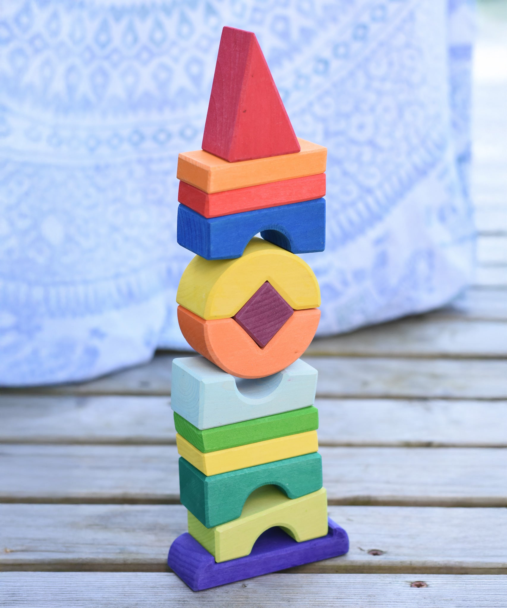 The Glückskäfer Crooked Tower placed on a wooden surface. 