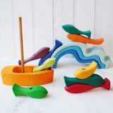 and sizes of fish. The set includes a wooden boat with a sail.