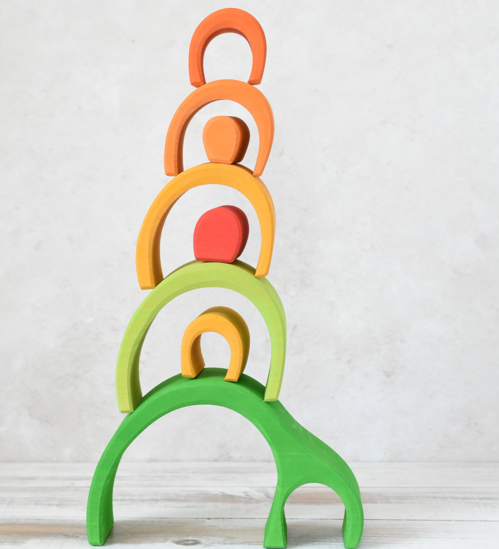 Glückskäfer Green 8 Piece Arch House with the pieces stacked up.