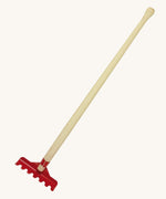 The Gluckskafer outdoor toy rake, with a long 60cm wooden handle and a red metal rake