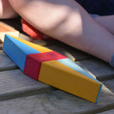 A close up of a kite shaped creation created using wooden toy blocks from the Glückskäfer 20-Piece Small Toscana Blocks Set. 