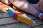 A close up of a kite shaped creation created using wooden toy blocks from the Glückskäfer 20-Piece Small Toscana Blocks Set. 