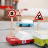 Gluckskafer speed and construction wooden mini traffic sign next to a play road with Candylab cars
