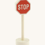 Gluckskafer small world wooden sign with stop in capital letters on a red sign