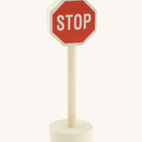 Gluckskafer small world wooden sign with stop in capital letters on a red sign