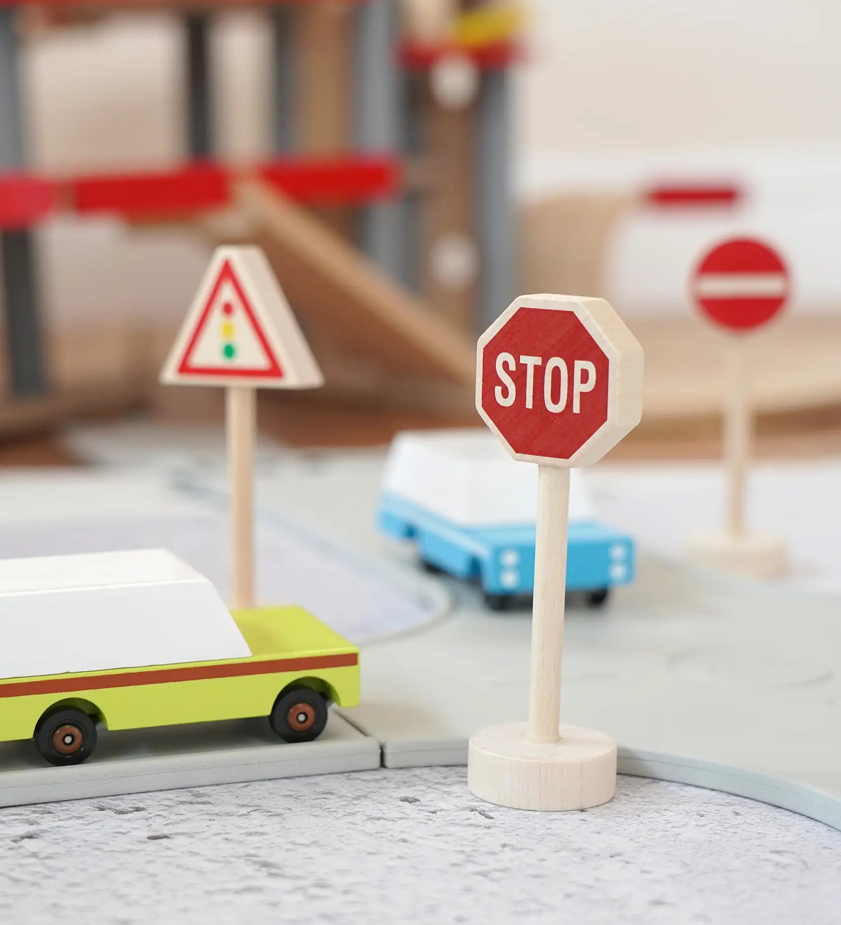 Gluckskafer miniature wooden traffic light, stop and no entry sign next to a playroad with Candylab cars