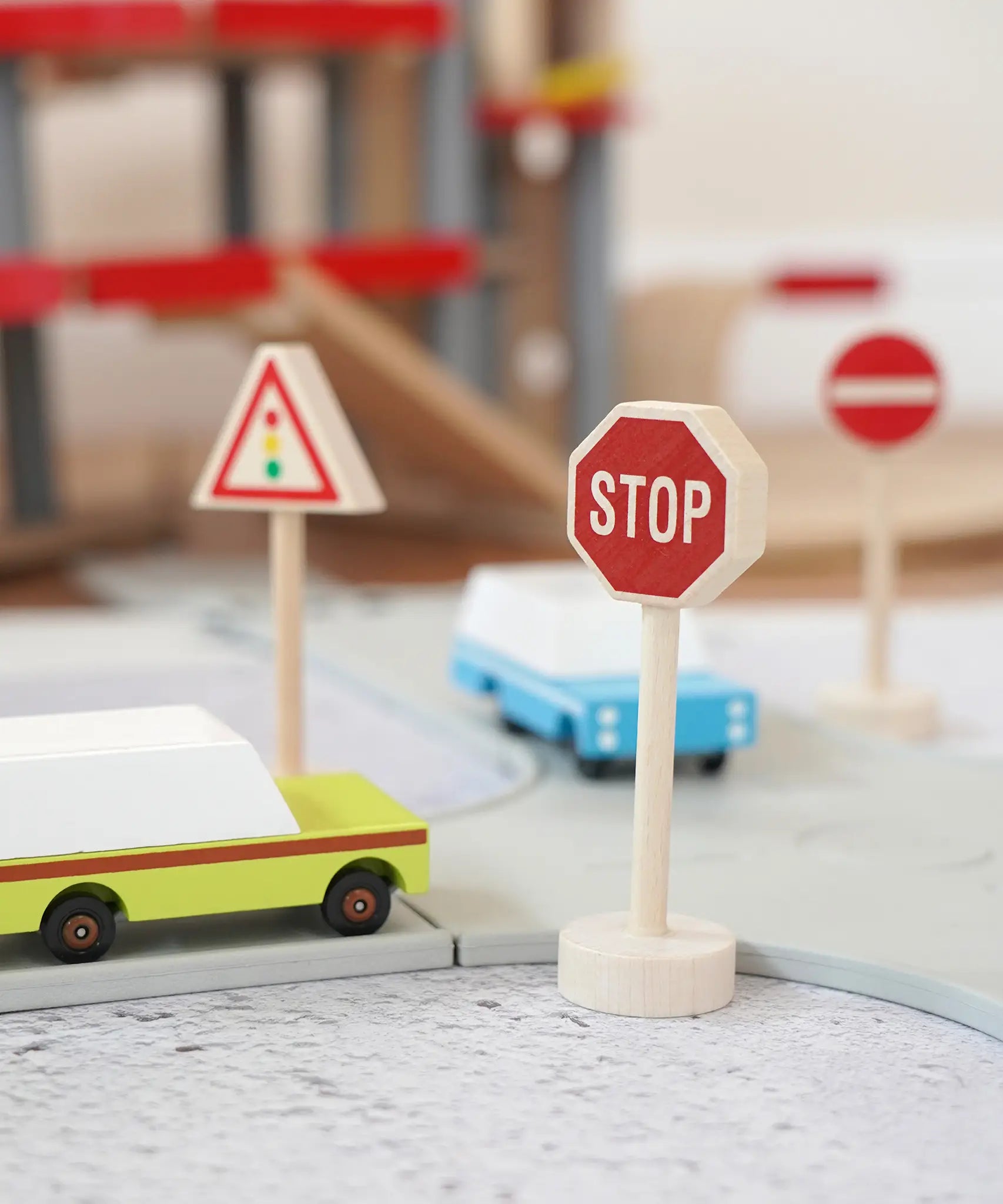 Gluckskafer miniature wooden traffic light, stop and no entry sign next to a playroad with Candylab cars