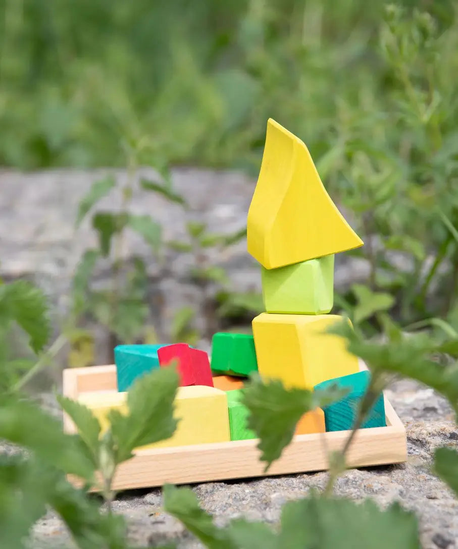 Glückskäfer Summer wooden play blocks. 11 colourful blocks stacked up on a wooden storage tray.