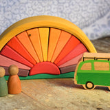 The Glückskäfer Yellow Sunray Arch in a simple small world play scene with the Lanka Kade camper van and Grapat Nins. 